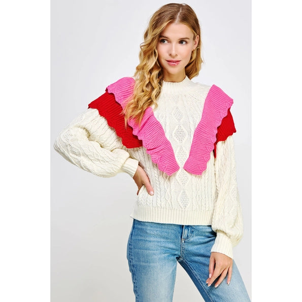 Present yourself with timeless sophistication wearing this exceptional crew neck sweater. Its contrasting ruffled scallops and variety of intricate cable knit patterns offer a masterful juxtaposition of refined elegance and modern chic. An exquisite piece crafted from luxurious materials, it will make you feel like royalty.